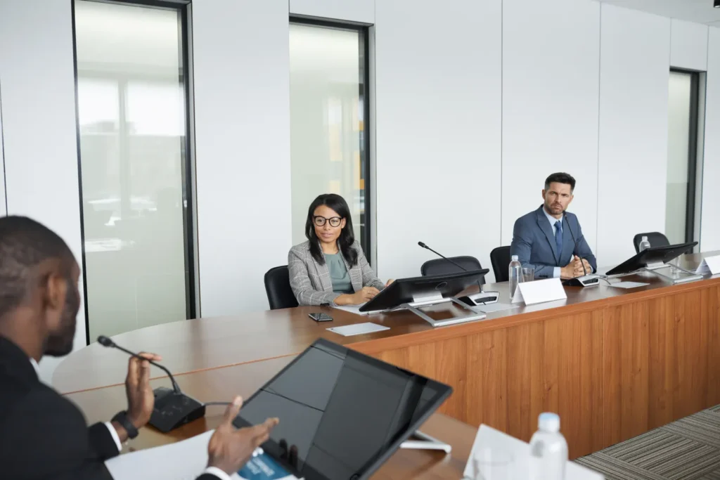Professionals discussing institutional strategy in a conference room