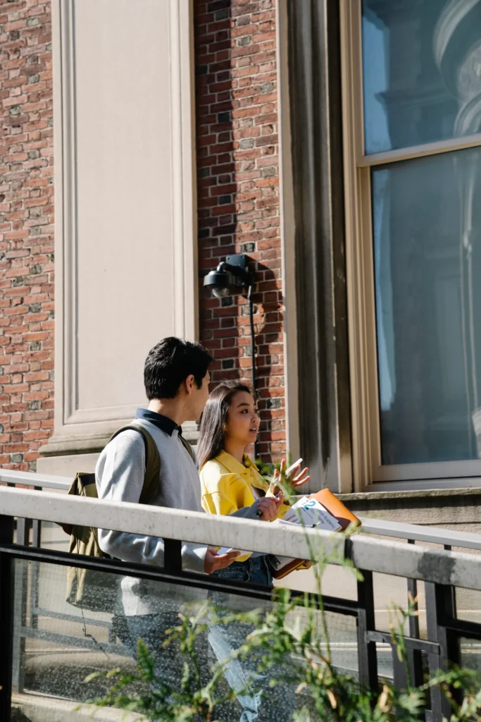 University students in conversation outside an academic building